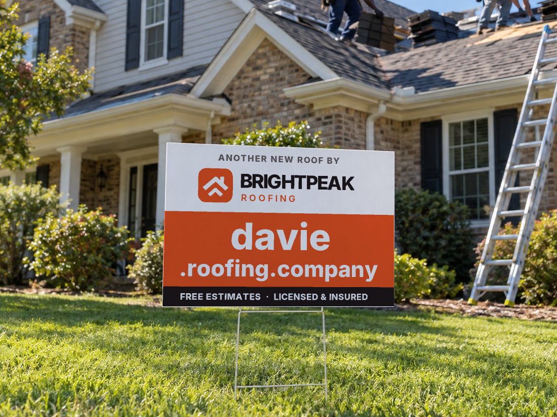davie.roofing.company on a yard sign in front of a house getting a new roof